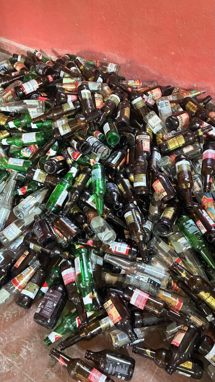 Large pile of bottles at recycling facility